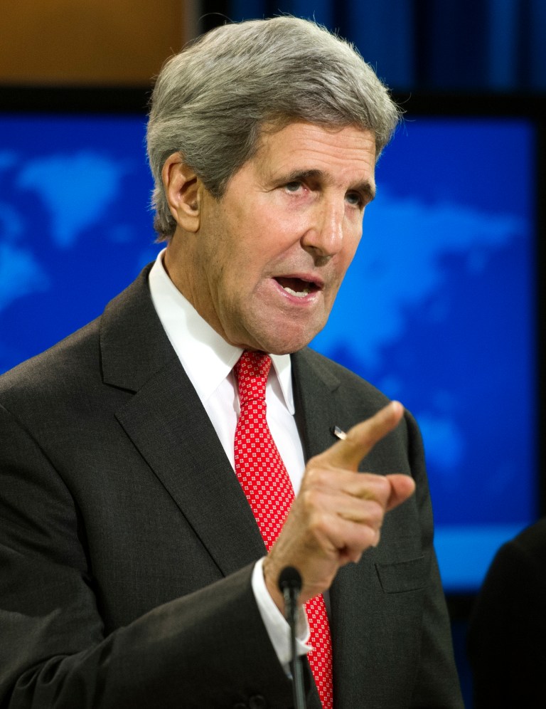Secretary of State John Kerry speaks at the State Department in Washington, Monday, July 28, 2014, during a news conference to announce the 2013 Annual Report on International Religious Freedom. The U.S. says millions of people were forced from their homes because of their religious beliefs last year. (AP Photo/Cliff Owen)
