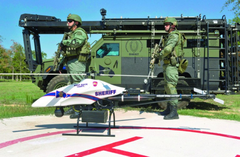 Vanguard Defense Industries/AP
Montgomery County, Texas, SWAT team members stand with a ShadowHawk drone.