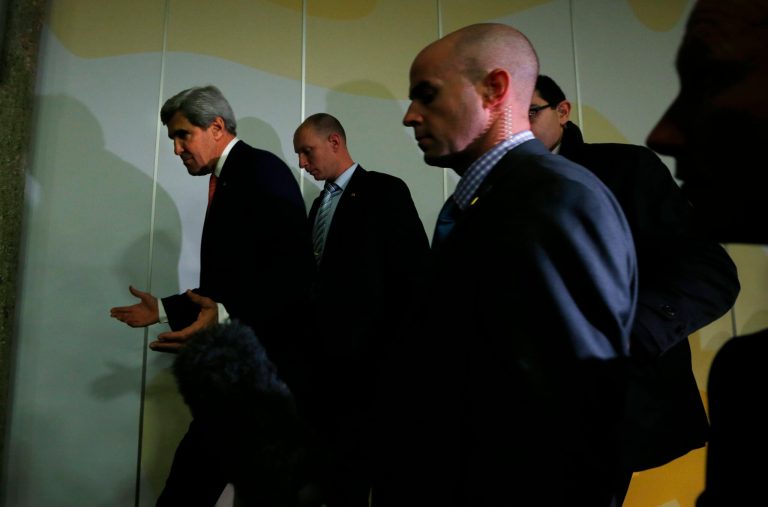 U.S. Secretary of State John Kerry, left, gestures while leaving a press conference at the end of the Iranian nuclear talks in Geneva, Sunday, Nov. 10, 2013. Nuclear talks with Iran have failed to reach agreement, but Kerry said differences between Tehran and six world powers made 