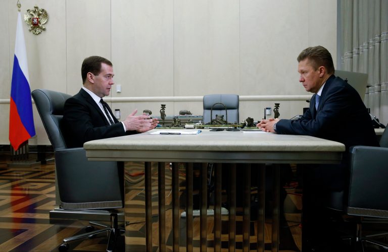 Russian Prime Minister Dmitry Medvedev, left, meets with Gazprom's Chief Executive Alexei Miller in Moscow, Russia, Thursday, April 3, 2014. Russian gas giant Gazprom on Thursday urged Ukraine to pay its debt, and announced a 70 percent rise in the charge for future supplies. (AP Photo/RIA-Novosti, Dmitry Astakhov, Government Press Service)