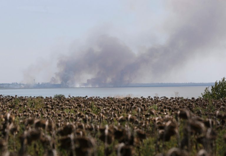 Smoke rises after shelling in the town of Novoazovsk, eastern Ukraine, Tuesday, Aug. 26, 2014. Towering columns of smoke rose Tuesday from outside a city in Ukraine's far southeast after what residents said was a heavy artillery barrage. It was the second straight day that attacks were reported in the vicinity of Novoazovsk, which is in eastern Ukraine's separatist Donetsk region but previously had seen little fighting between Ukrainian forces and pro-Russian rebels. (AP Photo/Sergei Grits)