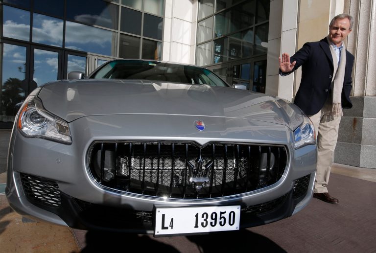   CEO of Maserati Harald Wester poses for photographers next to a new Maserati Quattroporte in Nice, southern France, during a presentation to the media, Monday, Dec. 10, 2012. The new sixth-generation Maserati Quattroporte is a luxury four-door saloon made by Maserati in Italy and will be shown at the Detroit motor show in January 2013, production started in November 2012. (AP Photo/Lionel Cironneau)  