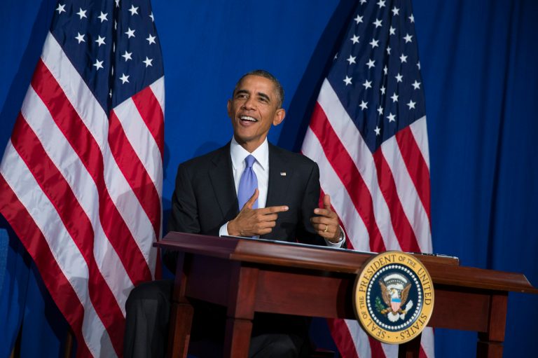 President Barack Obama smiles after signing an executive order to improve security measures for government credit and debit cards during an event at the Consumer Financial Protection Bureau, on Friday, Oct. 17, 2014, in Washington. (AP Photo/Evan Vucci)