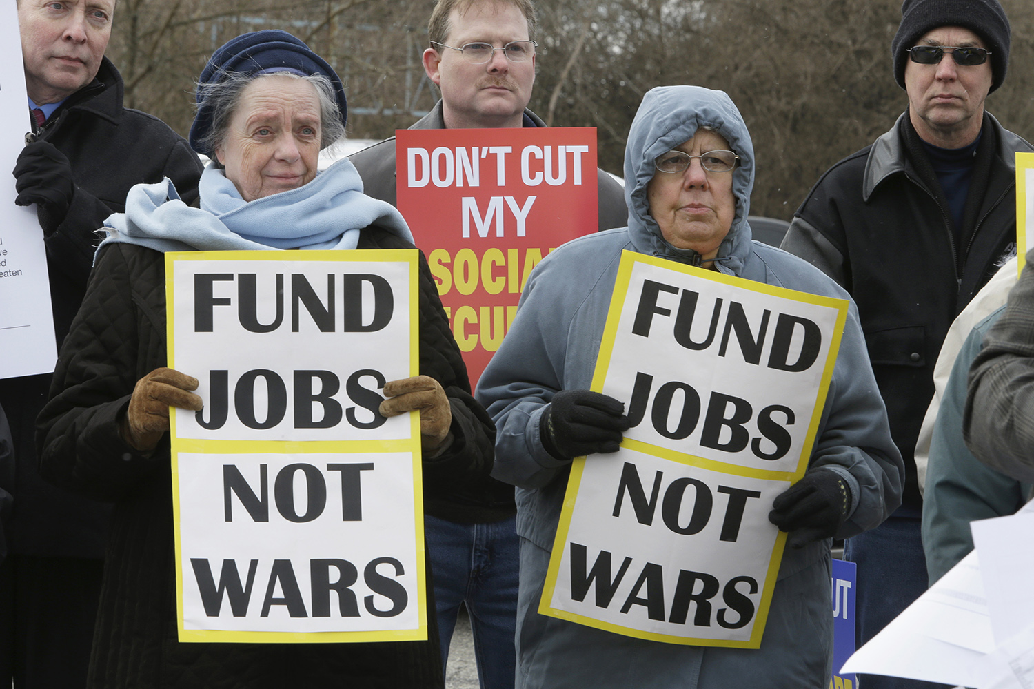 Economists see entitlement cuts or middle-class tax hikes as inevitable