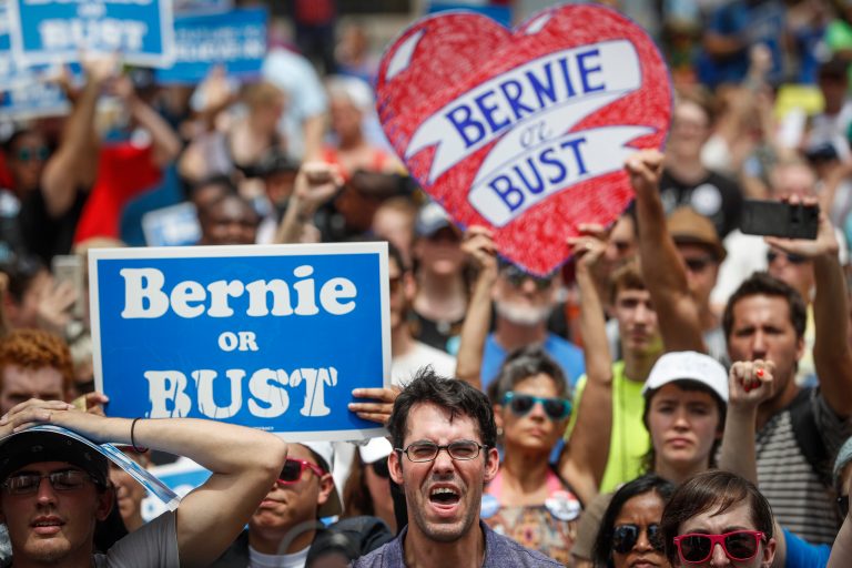 Clinton supporters who run the delegation tried to push Sanders supporters out of sight of the cameras. (AP Photo/John Minchillo)