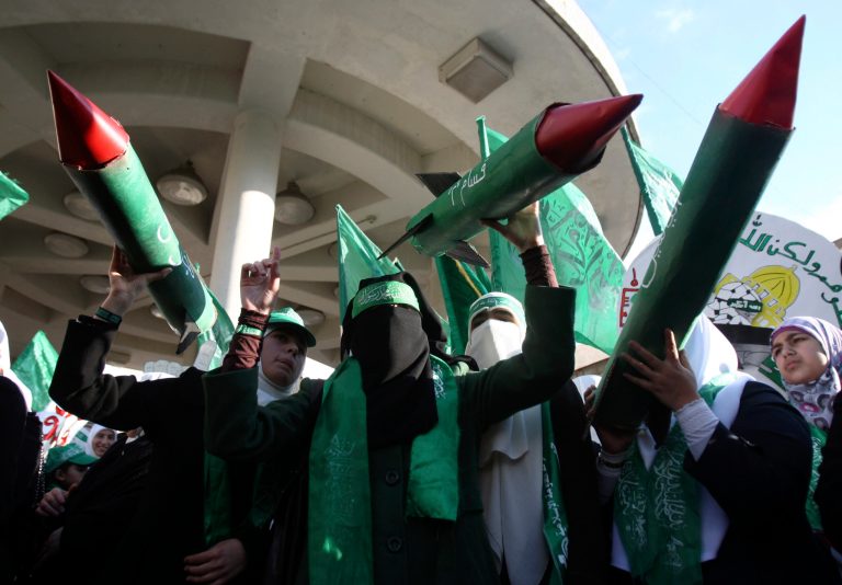   Palestinian supporters of Hamas hold models of M75 long-range rockets during a rally to celebrate the 25th anniversary of the Hamas militant group, in the West Bank city of Nablus, Thursday, Dec. 13, 2012. Hamas supporters rallied in the first display of force by the Islamic militant group in the West Bank since it overran Gaza from the Western-backed party of Palestinian President Mahmoud Abbas in 2007. (AP Photo/Nasser Ishtayeh)  