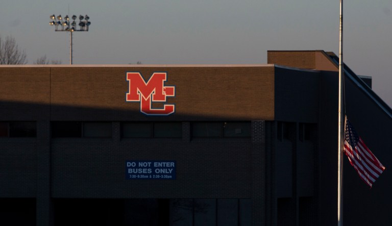 A flag outside Marshall County High School in Benton, Ky., flies at half-staff Thursday, Jan. 25, 2018. On Tuesday, a 15-year-old student opened fire at the school, killing two teenagers and wounding several others. (Ryan Hermens/The Paducah Sun via AP)