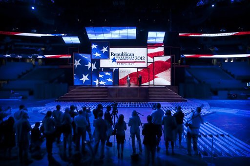 RNC Chairmain Reince Priebus, left, and RNC Chief Executive Officer Bill Harris unveil the stage built into the Tampa Bay Times Forum for the Republican National Convention on Monday, Aug. 20, 2012. The 13 video panels behind Priebus and Harris will help the Republicans get their message out when the convention kicks off on Monday, Aug. 27, 2012. (AP Photo/The Tampa Bay Times, Edmund D. Fountain) TAMPA OUT; CITRUS COUNTY OUT; PORT CHARLOTTE OUT; BROOKSVILLE HERNANDO TODAY OUT; MAGS OUT