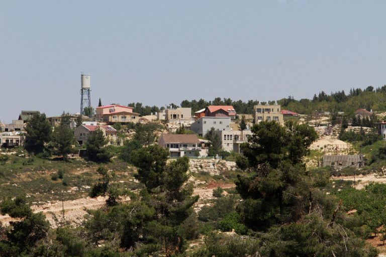 ADVANCE FOR USE MONDAY, APRIL 21, 2014 AND THEREAFTER - This Friday, April 18, 2014 photo shows the Jewish settlement of  Bat Ayin, north of the West Bank city of Hebron. Israeli settlers in the West Bank fall mostly under civilian rule, Palestinians are subject to Israeli military law. Israeli and Palestinian youths face inequities at every stage in the path of justice, from arrests to convictions and sentencing, according to police statistics obtained by The Associated Press through multiple requests under Israel's freedom of information law. (AP Photo/Nasser Shiyoukhi)