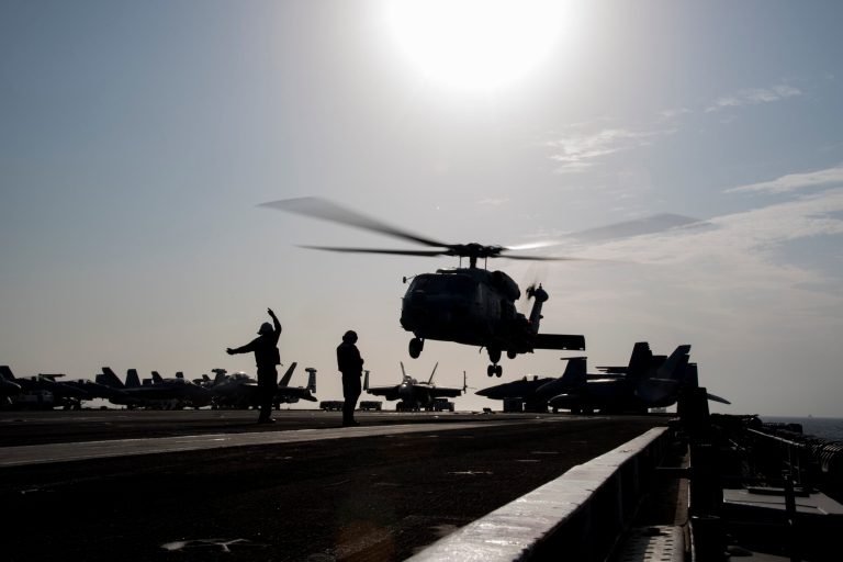 An MH-60R Seahawk helicopter prepares to land aboard the aircraft carrier Dwight D. Eisenhower on Saturday. A defense official said an Iranian boat pointed its weapon at this type of helicopter flying from Eisenhower in the Strait of Hormuz on Saturday. (Navy photo)