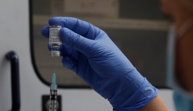 A vial of the Phase 3 Novavax coronavirus vaccine is seen ready for use in the trial at St. George's University hospital in London, Oct. 7, 2020. The FDA granted Novavax an Emergency Use Authorization for it's vaccine to be used in adults 18 and over. (AP Photo/Alastair Grant, File)