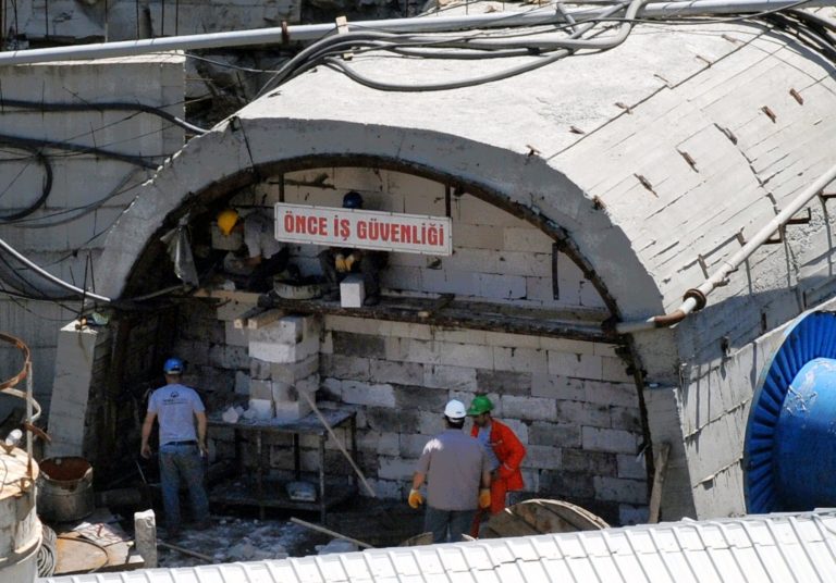 Miners close an entrance to their coal mine in Soma, Turkey, Sunday, May 18, 2014. Eighteen people, including company executives, have been detained as Turkish officials investigate the mining disaster that killed 301 people, a domestic news agency reported Sunday.(AP Photo/Depo Photos)