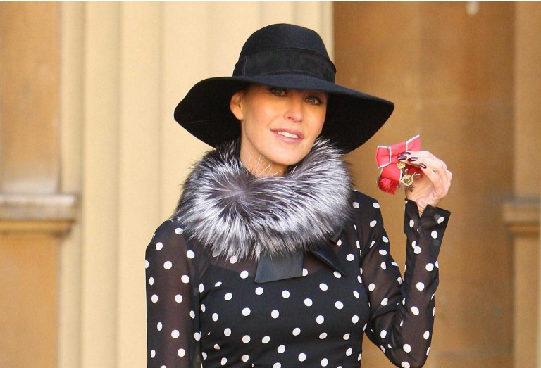 FILE-  In this Wednesday Oct. 20, 2010 file photo, Britain's Tamara Mellon, co-founder of Jimmy Choo, displays her OBE, which was awarded by Britain's Queen Elizabeth II, at an investiture ceremony at Buckingham Palace, London. Luxury shoemaker Jimmy Choo has announced plans to list at least a quarter of its shares on the London Stock Exchange next month in Oct. 2014. The designer label, which recorded sales of 282 million pounds ($462 million) in 2013, said it is looking to expand in Asia and other new markets, and plans to open 10 to 15 stores per year. Malaysian-born designer Jimmy Choo and the brand's co-founder Tamara Mellon opened their first store in London in 1996. It is now owned by private investment firm JAB Luxury, which acquired it in 2011, and the label now has 120 stores worldwide. Peter Harf, non-executive chairman of Jimmy Choo, said in a statement Tuesday the company is 