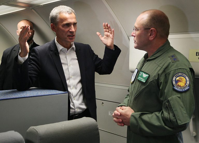 New NATO Secretary General Jens Stoltenberg of Norway, left, talks with Major General Andrew Mueller, right, commander of E-3A component during his visit to the 32 Tactical Air Base in Lask, Poland, Monday, Oct. 6, 2014. Stoltenberg is in Poland on his first foreign trip since starting the job last week, a visit meant to reassure a nervous ally on the alliance's eastern flank. (AP Photo/Czarek Sokolowski)