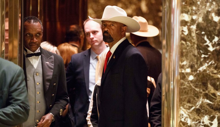 Former Milwaukee County Sheriff David Clarke's around-the-clock home security already cost taxpayers a staggering $226,000 in 2017, according to a report Wednesday, though he will no longer receive the protection going forward. (AP Photo/Evan Vucci, File)