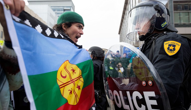 Protesters were stopped from marching up State Street in Salt Lake City on Monday during President Trump's announcement to eliminate vast portions of Utah's Bears Ears and Grand Staircase-Escalante national monuments. (Laura Seitz/The Deseret News via AP)