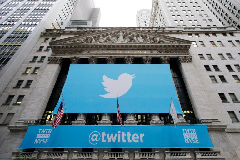 FILE - In this Thursday, Nov. 7, 2013 file photo, a banner with the Twitter logo hangs on the facade of the New York Stock Exchange in New York the day after the company went public. Stocks are down for many technology companies, including Twitter, which is down 35 percent since early March 2014. Biotechnology companies have also been hit hard. (AP Photo/Mark Lennihan, File)