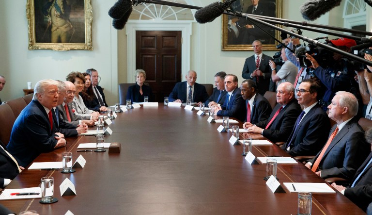 A handful of President Trump's Cabinet members attend Bible study together. (AP Photo/Evan Vucci)