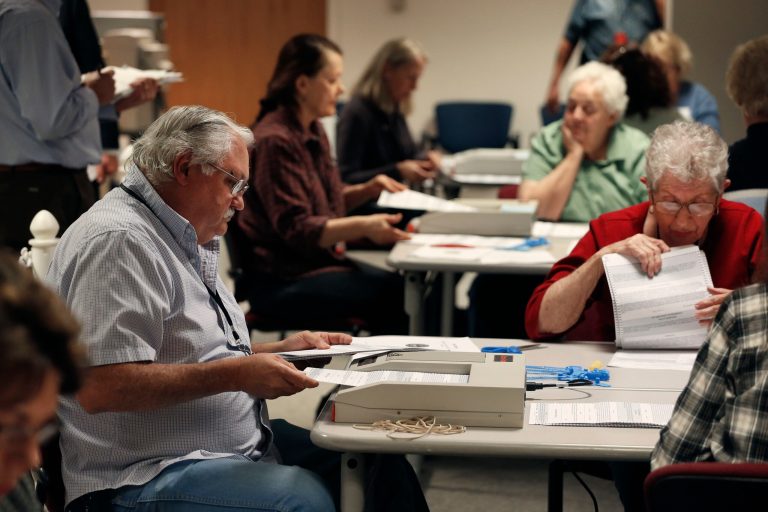 Election judge Rich Korinek, left, tallies ballots during a recount of Broomfield's vote on a county-wide hydraulic fracturing ban, at a city and county building, in Broomfield, Colo., on Monday. (AP/Brennan Linsley)