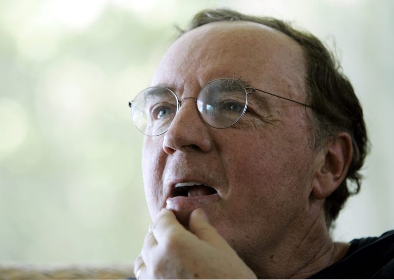 FILE - In this May 3, 2006, file photo, author James Patterson contemplates a question during an interview at his home overlooking the Intracoastal Waterway in Palm Beach, Fla. Patterson is giving away $1 million of his own money to independent bookstores and on Wednesday, Feb. 19, 2014, Patterson announced the first round of 55 stores to receive over $267,000 in funds. The remaining $750,000 will be given out in stages throughout the year. (AP Photo/Wilfredo Lee, File)