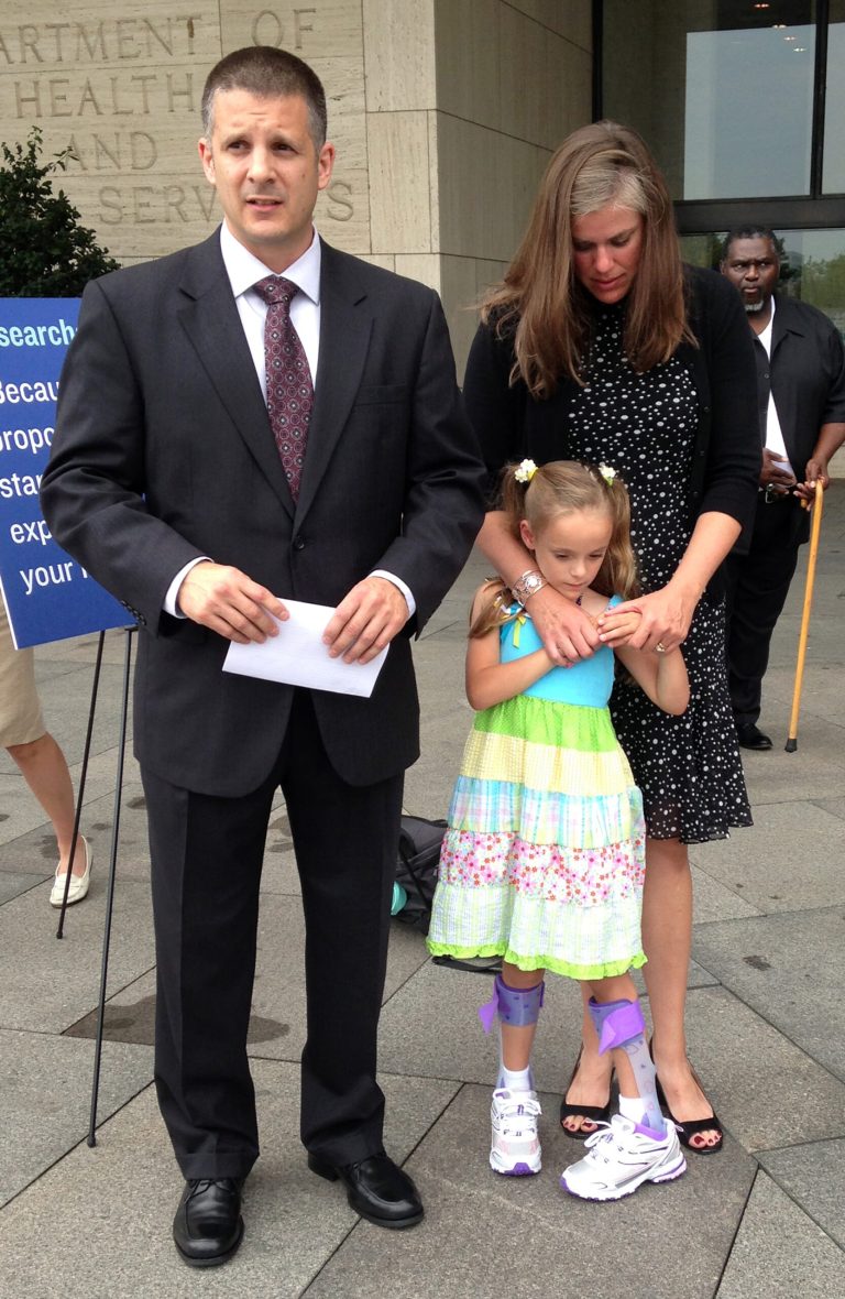   Shawn and Carrie Pratt of Kingwood, W.Va., with their daughter Dagen, speak to the media outside a federal health meeting in Washington, Wednesday, Aug. 28, 2013. Dagen was part of a controversial study of premature babies that has sparked questions about how to inform patients about the risks of medical research. (AP Photo/Lauran Neergaard)  