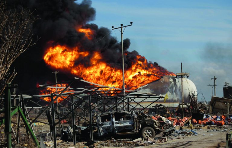 Fires continue to burn at the Amuay refinery near Punto Fijo, Venezuela, Monday, Aug. 27, 2012. A huge explosion rocked Venezuela's biggest oil refinery early Saturday killing at least 39 people and injuring more than 80 in Venezuela's deadliest refinery blast ever. (AP Photo/Ariana Cubillos)
