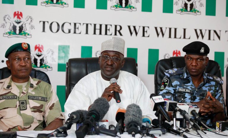 Brig. Gen. Chris Olukolade, Nigeria's top military spokesman, from left, National Orientation Agency Director General Mike Omeri, and national police spokesman Frank Mba attend a press conference on the abducted school girls in Abuja, Nigeria, Monday, May 12, 2014. (AP Photo/Sunday Alamba)