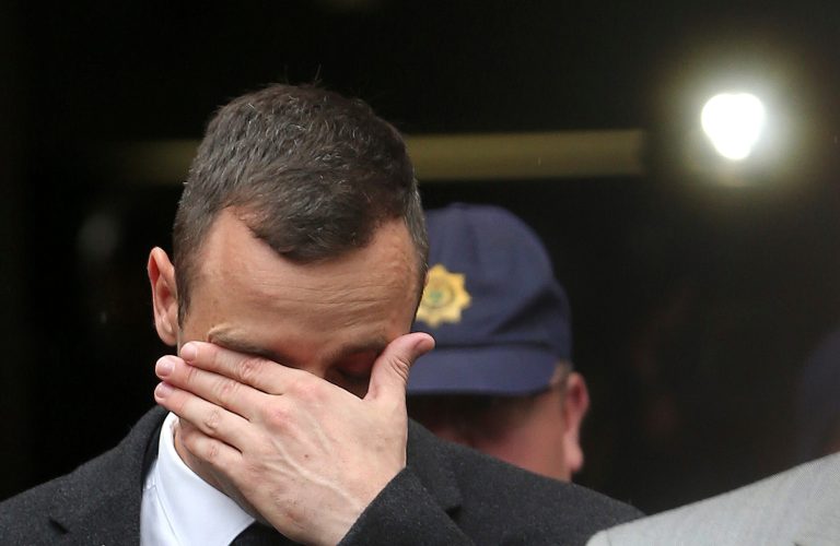 File: In this Monday, April 14, 2014 file photo, Oscar Pistorius leaves the high court in Pretoria, South Africa. The murder trial of  Pistorius is expected to enter a critical phase of testimony Monday as the defense attempts to overcome a faltering start and show how the disabled Olympic athlete fatally shot girlfriend Reeva Steenkamp by mistake because he was overwhelmed by a long-held fear of violent crime. (AP Photo/Themba Hadebe-File)
