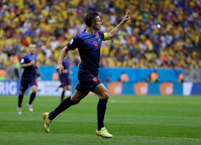 Netherlands' Robin van Persie celebrates after scoring his team's first goal on a penalty shot during the World Cup third-place soccer match between Brazil and the Netherlands at the Estadio Nacional in Brasilia, Brazil, Saturday, July 12, 2014. (AP Photo/Natacha Pisarenko)