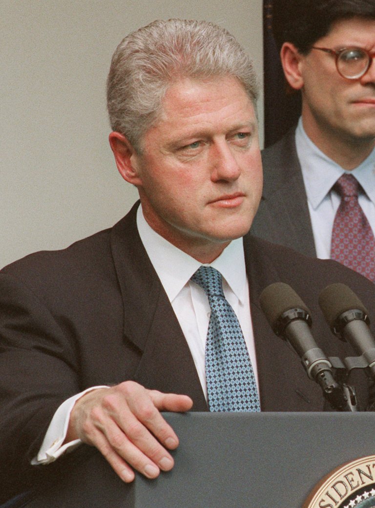 President Clinton responds to a question regarding former employees of the White House travel office while meeting reporters in the Rose Garden of the White House Thursday, Aug. 1, 1996, to discuss the economy. The president angrily withdrew a White House promise to pay the legal bills of fired travel office employees declaring, 