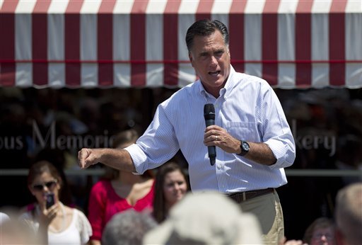 Republican presidential candidate, former Massachusetts Gov. Mitt Romney gestures during a campaign stop at Sweetie-licious Bakery on Tuesday, June 19, 2012 in DeWitt, Mich.  (AP Photo/Evan Vucci)