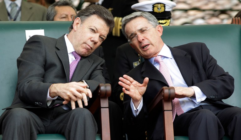 Colombian President Juan Manuel Santos met with former President Alvaro Uribe on Wednesday to discuss how to work out their differences after the public rejected a referendum on Sunday that would have concluded a peace deal with FARC. (AP Photo/Fernando Vergara, File)