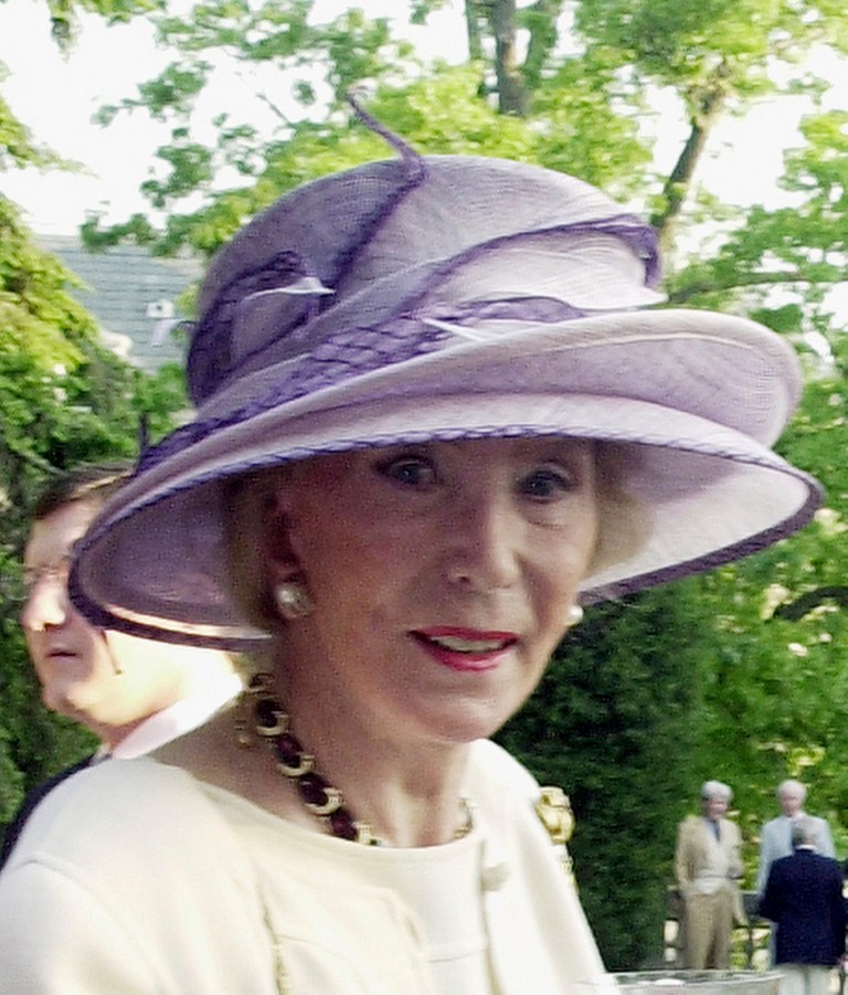 This May 12, 2004 photo shows German socialite Viola Drath during the annual Woodrow Wilson home garden party and hat contest in Washington. A German man who masqueraded as an Iraqi general and other eccentric characters was sentenced Wednesday to 50 years in prison for the murder of his 91-year-old wife in Washington. Albrecht Muth was convicted in January of killing his wife, Viola Drath, a German writer and socialite. She was found dead in the couple's row home in Washington's posh Georgetown neighborhood in August 2011.  (AP Photo/Washington Times, James R. Brantley)
