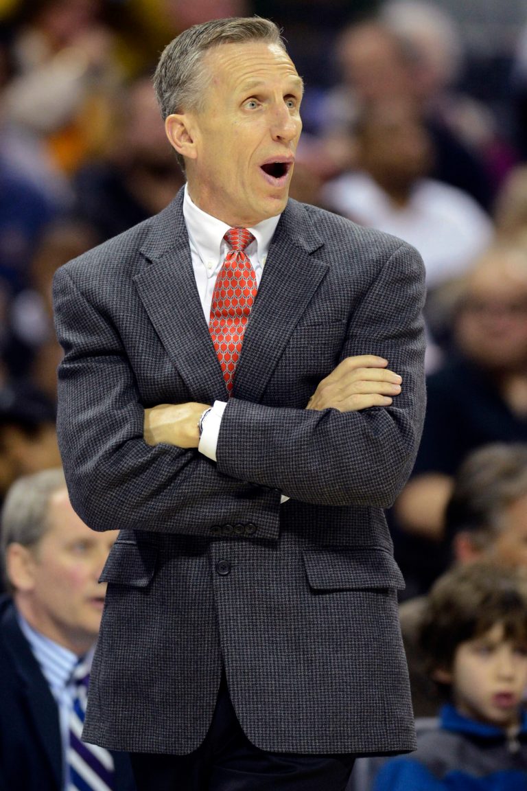   Charlotte Bobcats head coach Mike Dunlap discusses a call with an official during the second half of their NBA basketball game against the Miami Heat, Wednesday, Dec. 26, 2012, in Charlotte. The Heat won 105-92. (AP Photo/The Charlotte Observer, David T. Foster III) MAGS OUT; TV OUT; NEWSPAPER INTERNET ONLY  