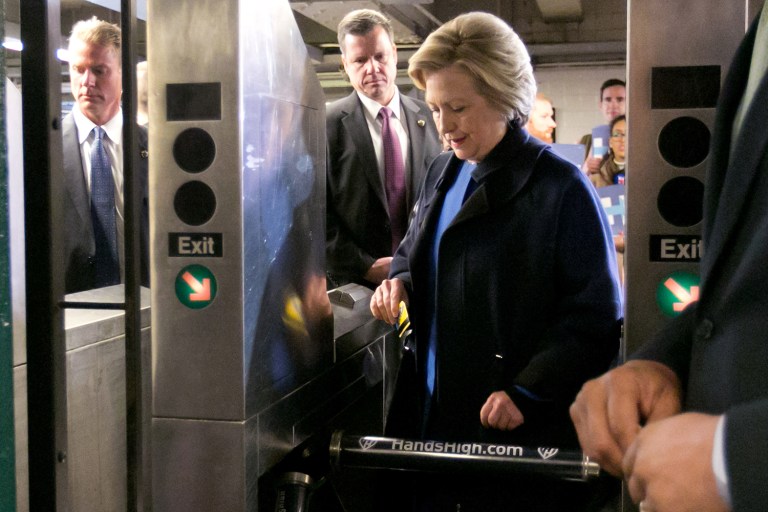 Democratic presidential candidate Hillary Clinton goes through the turnstile to enter the New York City subway. (AP Photo/Richard Drew)