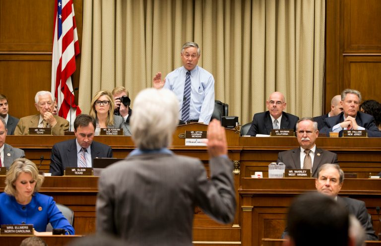Health and Human Services Secretary Kathleen Sebelius is sworn in on Capitol Hill in Washington, Wednesday, Oct. 30, 2013, by House Energy and Commerce Committee Chairman Rep. Fred Upton, R-Mich., prior to testifying before the committee's hearing on the difficulties plaguing the implementation of the Affordable Care Act. Sebelius, President Barack Obama's top health official faced tough questioning by a congressional committee Wednesday that will demand she explain how the administration stumbled so badly in its crippled online launch of the president's health care overhaul. (AP Photo/ Evan Vucci)