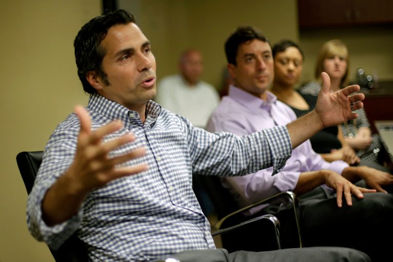U.S. Senate candidate Greg Orman talks to workers at a healthcare company in Overland Park, Kan. (AP/Charlie Riedel)