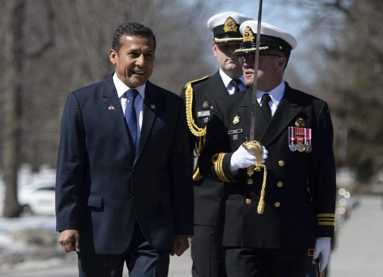 Peru President Ollanta Humala, left, is welcomed by military honors as he arrives at Rideau Hall during a state visit in Ottawa on Wednesday, April 9, 2014. Peruvian security forces have arrested 24 leaders of the political wing of the Shining Path rebel movement including the lawyer of its imprisoned leader and the cousin of Humala, the Peruvian president announced Thursday. (AP Photo/The Canadian Press, Sean Kilpatrick)