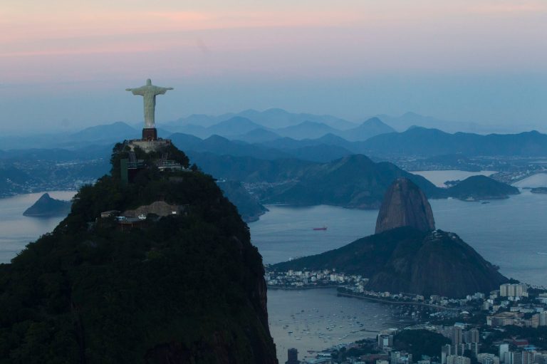   FILE - In this May 10, 2012 file photo, the Christ the Redeemer statue stands back dropped by Sugar Loaf mountain, right, as the sun sets in Rio de Janeiro, Brazil. For more than a decade, Brazil has been one of the developing world's great hopes, outpacing the growth of Western Europe and the U.S. Many even predicted it would soon become an economic superpower, but now analysts generally believe the big boom is past. (AP Photo/Felipe Dana, File)  