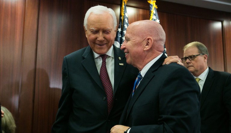 House Ways and Means Committee Chairman Kevin Brady, R-Texas, shakes hands with Senate Finance Committee Chairman Orrin Hatch, R-Utah, at a joint tax conference on Wednesday, Dec. 13, 2017. GOP leaders announced they have forged an agreement on tax reform, which includes a provision that would eliminate Obamacare penalties waged on people who do not have health insurance. (Graeme Jennings / Washington Examiner)