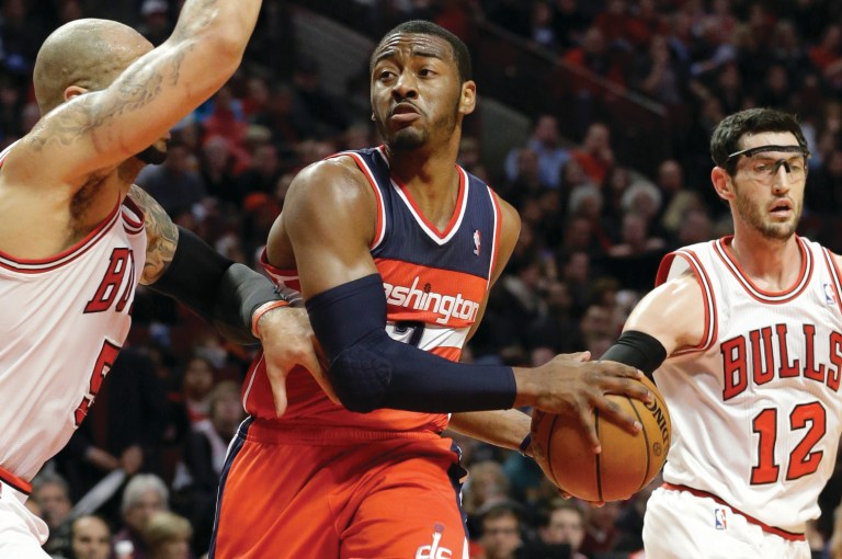 Nam Y. Huh/AP
Wizards guard John Wall scored 18.5 points per game on 44.1 percent shooting and added 7.6 assists per game.