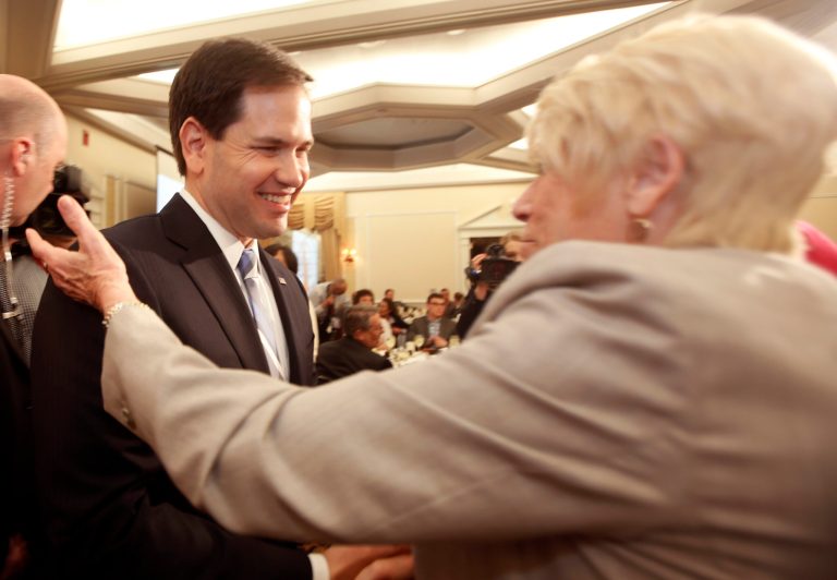 Republican presidential hopeful Sen. Marco Rubio, R-Fla., is greeted as he arrives at the Republican Leadership Summit Friday, April 17, 2015, in Nashua, N.H. (AP Photo/Jim Cole)
