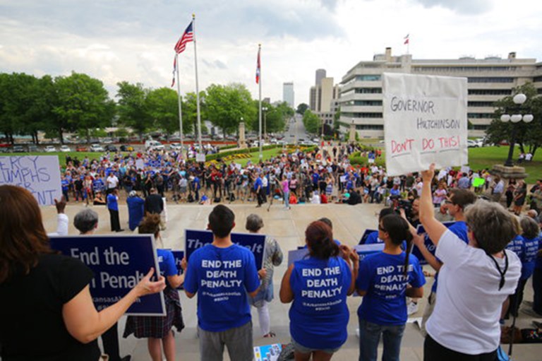 People gather at a rally opposing the state's upcoming executions, on the front steps of Arkansas' Capitol, Friday, April 14, 2017, in Little Rock, Ark. (Stephen B. Thornton/The Arkansas Democrat-Gazette via AP)