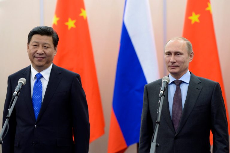 Russian President Vladimir Putin, right, and Chinese President  Xi Jinping take part in a video conference with commanders of Russian and Chinese navy ships in the Bocharov Ruchei residence in Sochi, Russia, in Sochi, Russia, Thursday, Feb. 6, 2014. Xi Jinping arrived in Sochi to attend the 2014 Winter Olympics. (AP Photo/RIA-Novosti, Alexei Nikolsky, Presidential Press Service)