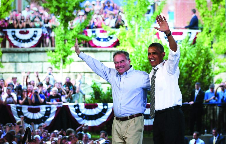 President Obama and Democratic U.S. Senate candidate and former Virginia Governor Tim Kaine wave to supporters during a campaign event at the Charlottesville nTelos Wireless Pavilion on Wednesday. (Photo by Alex Wong/Getty Images)
