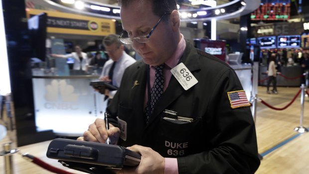 A trader works on the floor of the New York Stock Exchange. (AP Photo/Richard Drew)
