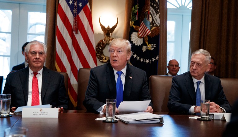 Secretary of State Rex Tillerson, left, and Secretary of Defense Jim Mattis, right, listen as President Trump speaks during a cabinet meeting at the White House, Wednesday, Dec. 20, 2017, in Washington. (AP Photo/Evan Vucci)