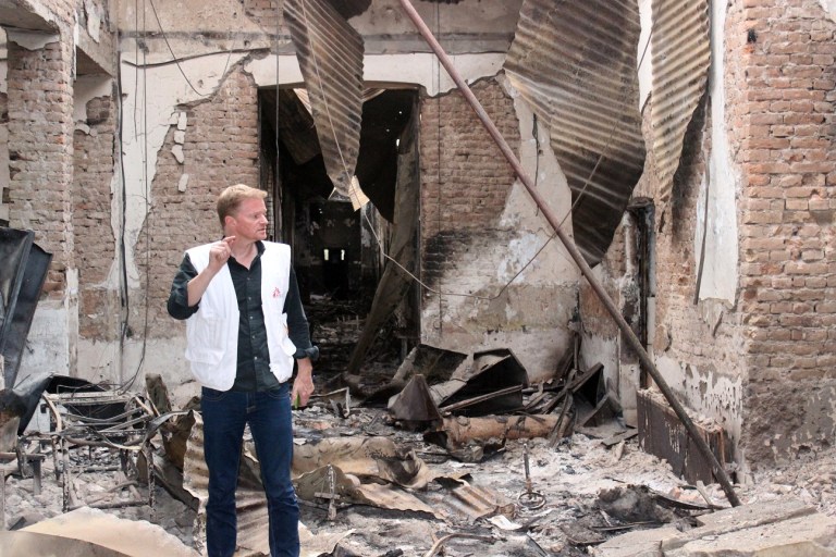 Christopher Stokes, the general director of the medical charity stands amid the charred remains of the organization's hospital, after it was hit by a U.S. airstrike in Kunduz, Afghanistan. (Najim Rahim via AP)