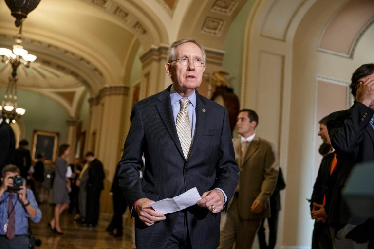 Senate Majority Leader Harry Reid is threatening to attach comprehensive immigration reform to targeted legislation intended to address the border crisis. (AP/J. Scott Applewhite)