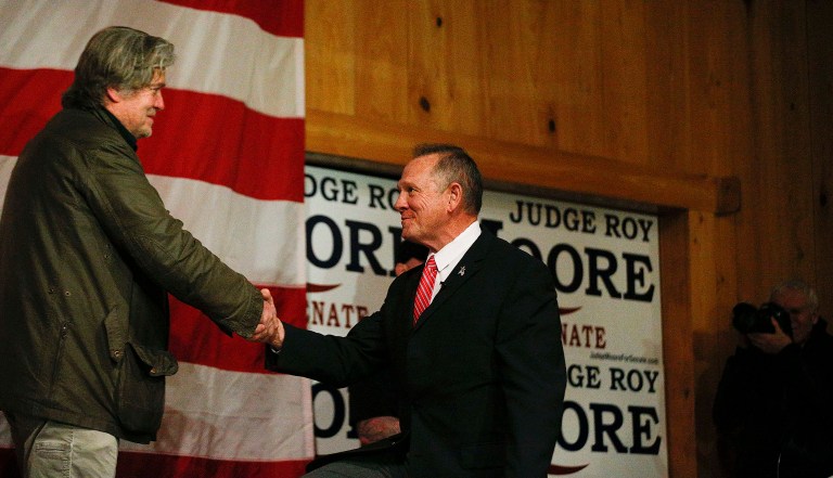 Steve Bannon, left, introduced U.S. senatorial candidate Roy Moore, right, during a campaign rally, Tuesday in Fairhope, Ala. (AP Photo/Brynn Anderson)